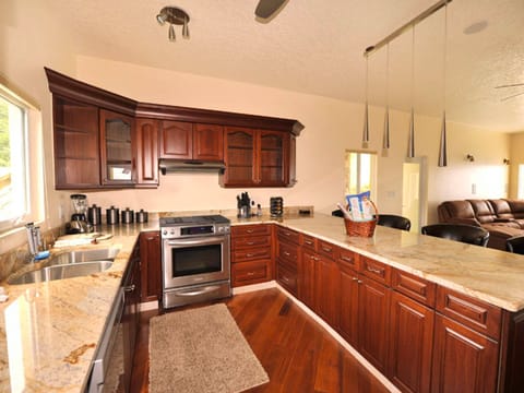 Deluxe Suite, 2 Bedrooms | Private kitchen | Full-size fridge, microwave, stovetop, dishwasher