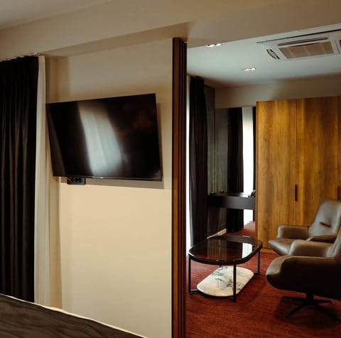 Deluxe Suite, Balcony | Desk, laptop workspace, blackout drapes, iron/ironing board