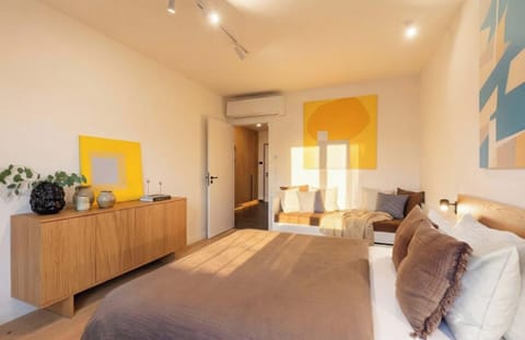 First bedroom with queen size bed and double / single bed