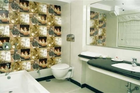 Shower, hair dryer, slippers, towels