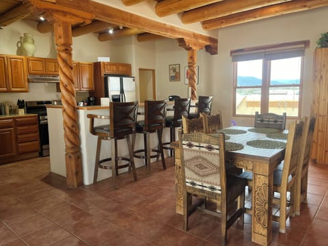Kitchen and dining area with bar seating