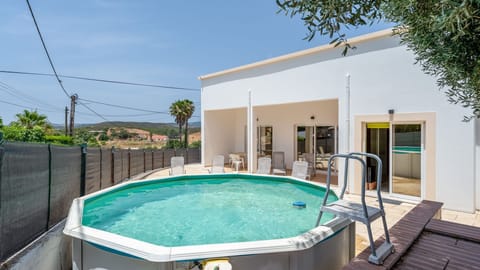 Relax by the private pool, surrounded by a tranquil garden and scenic views, perfect for enjoying sunny Algarve days. #privatepool #gardenretreat #relaxation #algarve