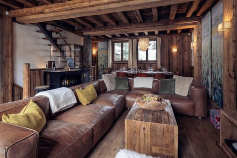 Each luxurious corner of the chalet is thoughtfully designed, featuring rich wood accents and elegant furnishings that create a warm, inviting atmosphere throughout.