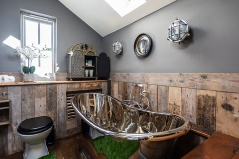 The Bathroom with huge copper bath