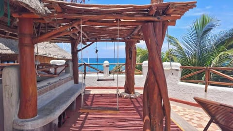 Shared rooftop terrace with loungers