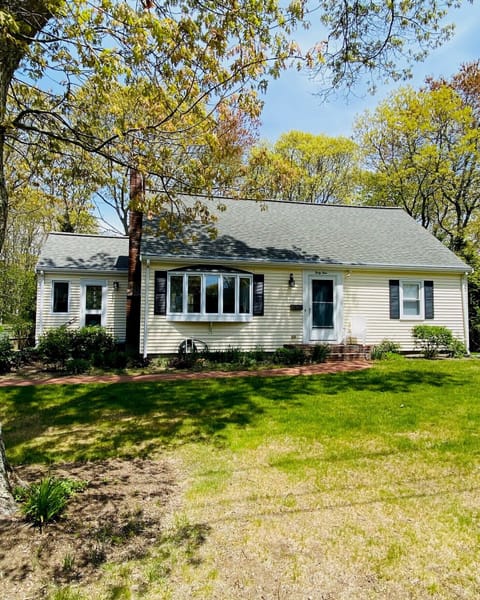 Front yard has water views and space for lawn games.