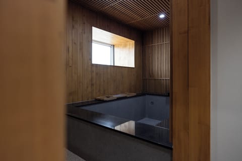 Deep soaking tub, hair dryer, bathrobes, slippers