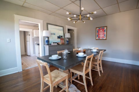 Spacious living area with dining table and comfortable seating.