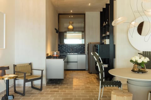 The fully equipped kitchen boasts modern appliances, a wine cooler, and everything needed for a stress-free, self-catered holiday