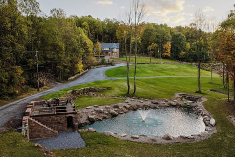 Spring fed pond & fountain at the center of the property
