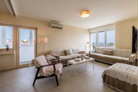 Classic Apartment, Sea View | Living area | 65-inch flat-screen TV with satellite channels