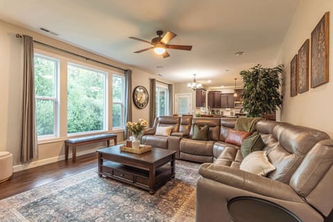 The living room combines warmth and style, featuring comfortable seating and a relaxing atmosphere that’s perfect for gathering together.