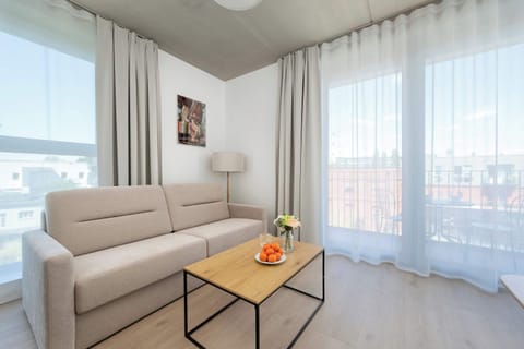 Living room with a comfortable sofa and TV. 