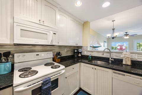 Kitchen, fully stocked with cooking/eating/drinking utensils