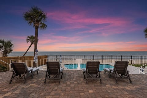 Soak in breathtaking sunsets while lounging just steps from the ocean!