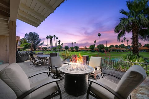 Enjoy the view while relaxing by the fire table with a glass of wine.