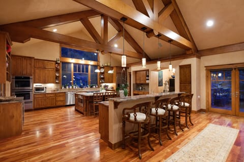 Open floor plan view of kitchen and two seating bar areas