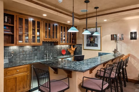 Downstairs kitchenette and bar/seating area