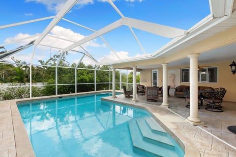 Large salt water pool heated to 83f.   Covered Lanai & cage for family enjoyment. 