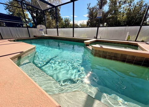 Pool/spa with LED basketball hoop.  Gate can be put up for child safety.
