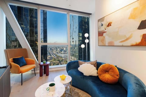 Living area with city views and direct view to Queen Victoria Market
