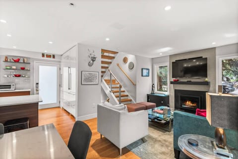 The open living space is both bright and cozy with inviting spaces to relax and unwind with your travel companions.