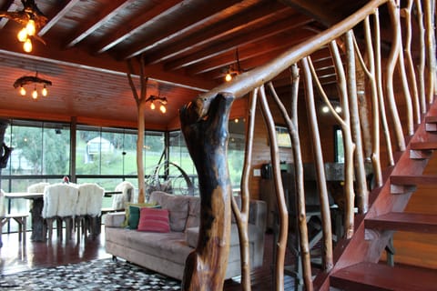 Deluxe Chalet, Patio, Lake View | Living area | TV