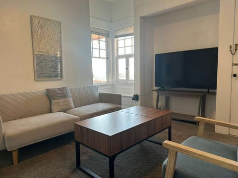 Living room with cozy seating and TV for relaxing evenings