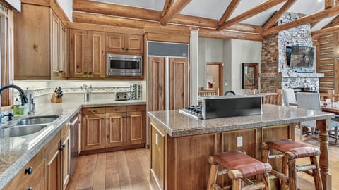 Kitchen, Main Level - Built in hood vent on the island