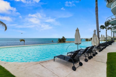 Deluxe Apartment | Pool | 2 outdoor pools, free cabanas, pool umbrellas