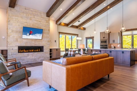 Main living area (living room, dining area, and kitchen). Windows on 3 walls.