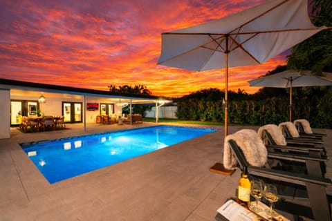 Unwind in your private tropical retreat as the sun sets and the pool glows beneath the palms. Lounge under umbrellas, sip your favorite drink, and soak in the peaceful, resort-style atmosphere—perfect for evening swims and late-night conversations.