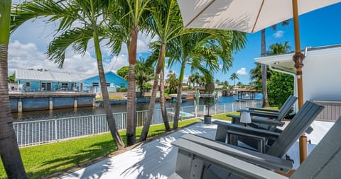Enjoy your own private slice of paradise with sparkling lakefront views, a private dock, and direct water access—perfect for paddleboarding, kayaking, or simply soaking in the Florida sunshine by the pool.