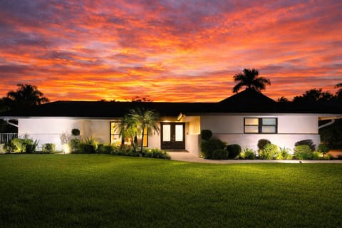 Enjoy peaceful waterfront living in this quiet Boynton Beach neighborhood, complete with glowing sunsets and tropical scenery