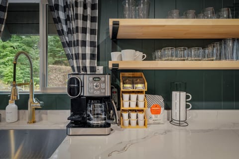 2-in-1 coffee maker for pots or single cups; pods & tea included.