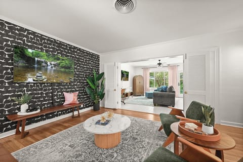 Living Room Retreat: Stylish space with bold decor, perfect for relaxation and entertainment!