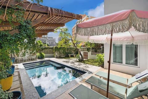 Relax under the parasol with a drink, and enjoy the sun.

