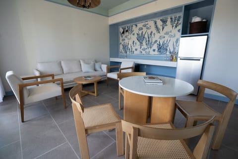 Spacious living room featuring natural light, clean design, and direct access to the patio.