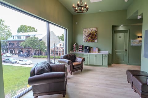 Guests have access to a shared coffee nook and sitting area overlooking Government Street