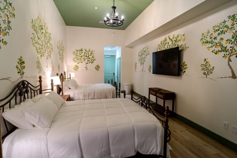 Boutique double room with hand-painted walls, spacious layout, and great natural light