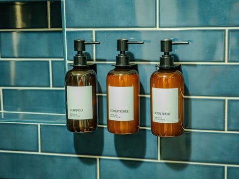 Hotel-Quality Amenities: Every bathroom in the home is stocked with premium essentials, including shampoo, conditioner, and body wash in sleek refillable bottles. For added convenience, guests will also find lotion and small personal items like a hai
