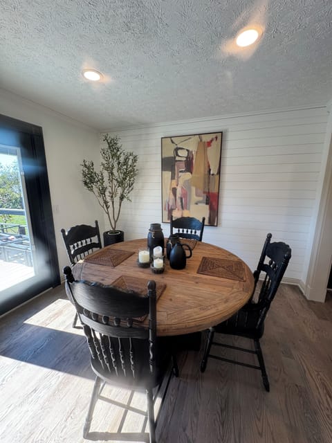 Dining area with seating for 8.  Bench and two additional chairs.