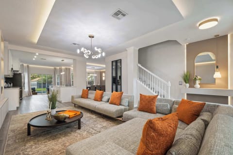 Expansive modern living room flowing to the outdoor patio.