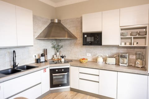 Kitchen, Kitchen Appliance, Countertop, Furniture, Cabinetry, Interior Design, Major Appliance, Flooring, Home Appliance, Wood