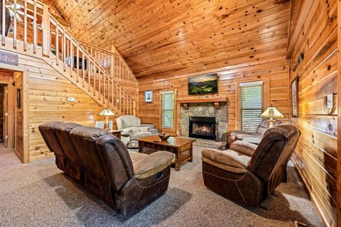 Gather by the stone fireplace, where the warm glow sets the tone for cozy evenings together.