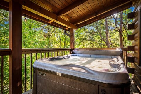 Unwind in the bubbling hot tub, sheltered under the roof yet open to the fresh mountain air.