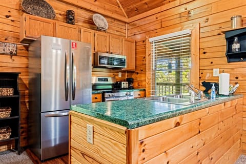 Stainless steel appliances stand ready for everything from pancake breakfasts to late-night snacks.