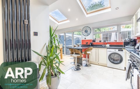 Enjoy morning coffee overlooking the garden from this chic kitchen.