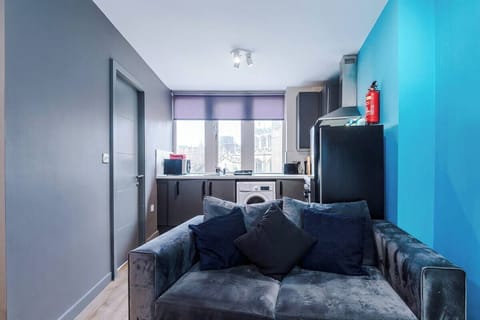 The stylish living area benefitting from a Smart TV with Netflix and a comfortable sofa.