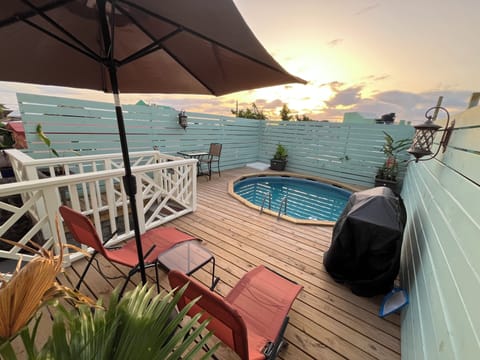 Shared pool deck with BBQ grill